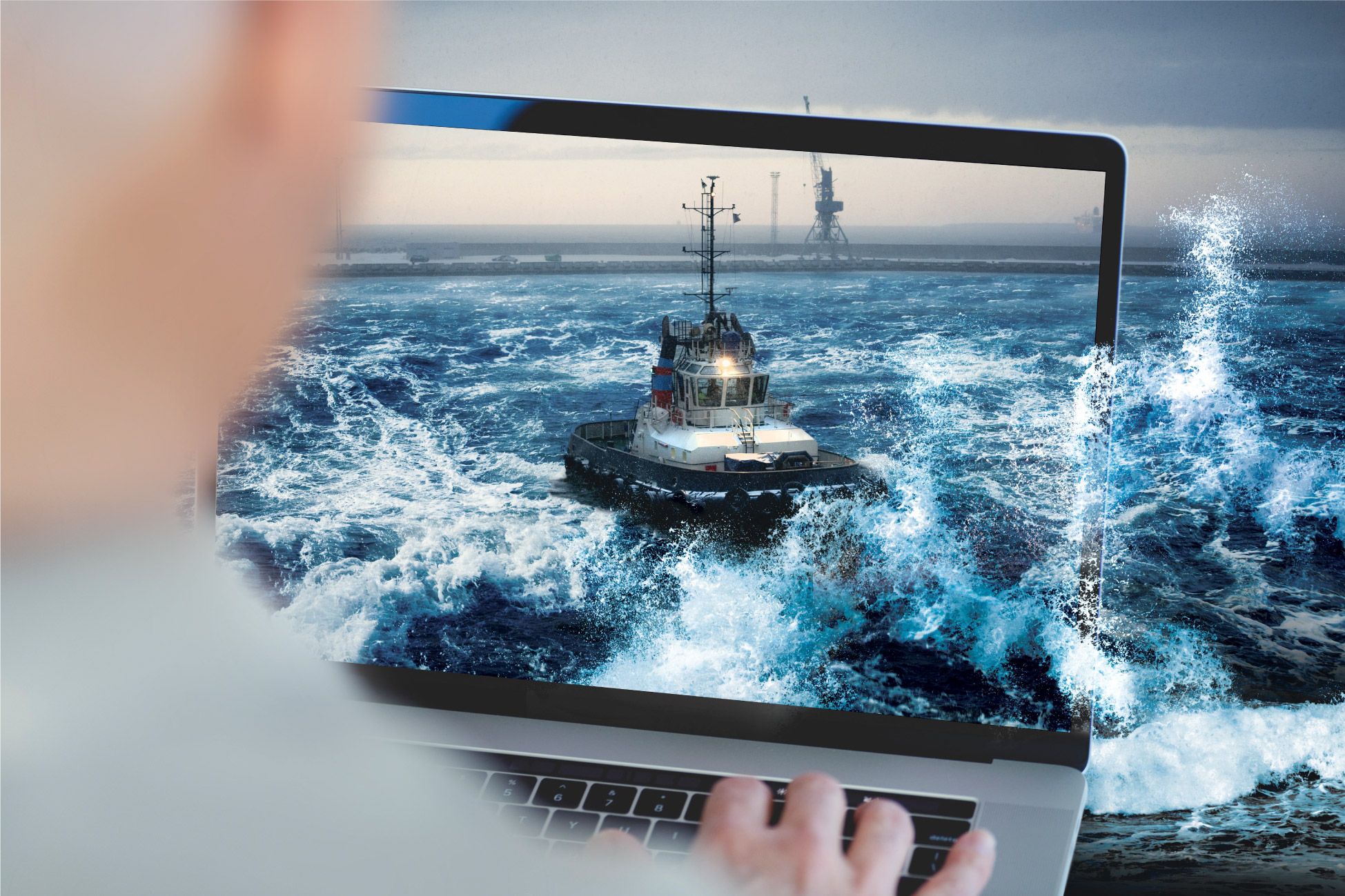 Boat coming out of a compute screen to illustrate how remote asset management helped a customer save money on fuel with Barefleet maritime software