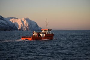 Boat in cold waters to illustrate maritime hybrid communications