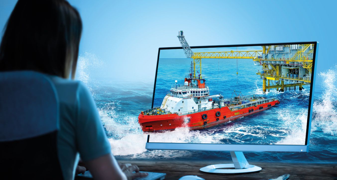 Foto de una mujer sentada ante un ordenador con un barco saliendo de la pantalla para ilustrar la gestión remota de activos de AST Networks
